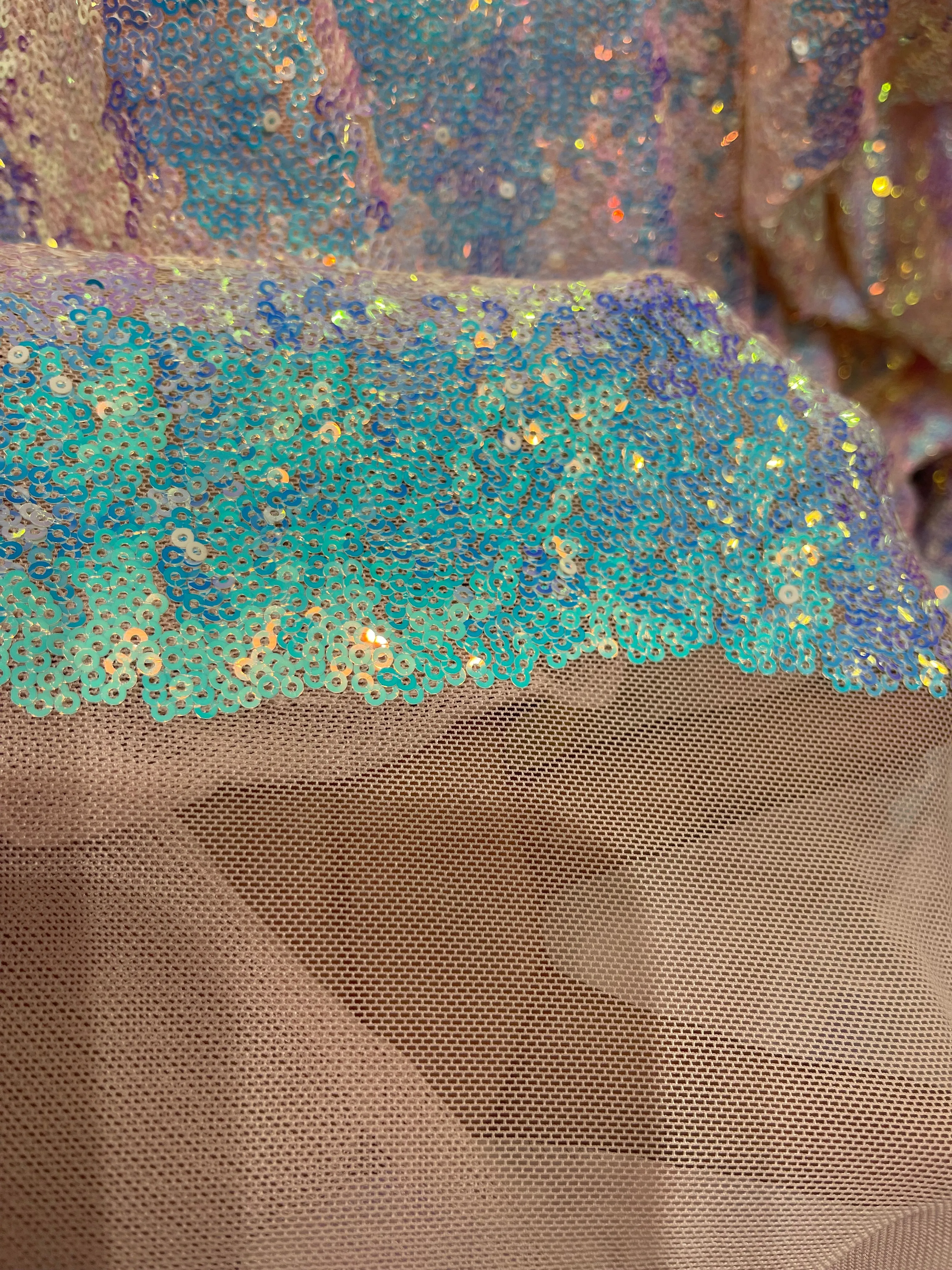 Aqua Iridescent Mini Glitz Sequins on a Blush  4 Way Stretch Mesh-Sold By The Yard.